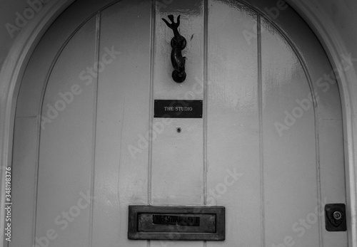 The music studio's door.
Black and white picture of the front door of a music studio in London, UK photo