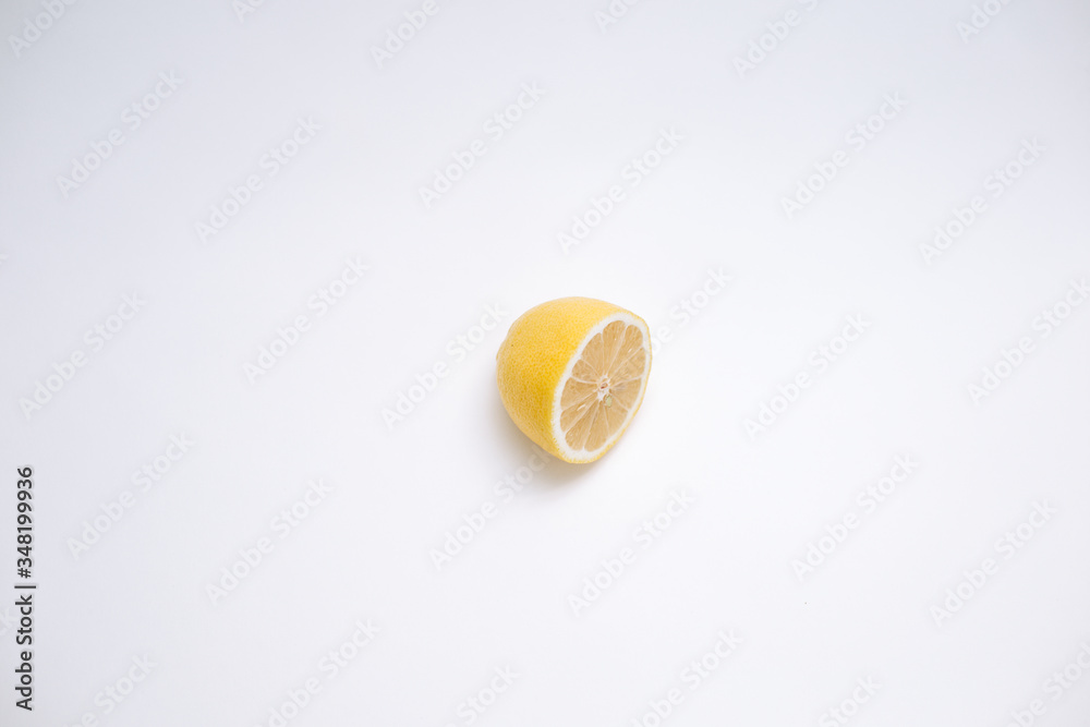 Cut lemon on white surface Cut lemon on white surface