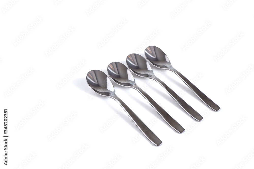 metal spoons on a white background. Spoons for eating. metal spoons on a white background. Spoons for eating.