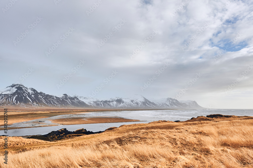 View of coastline and mountains near Budir in Snaefellsnes peninsula (region of Vesturland, Iceland)