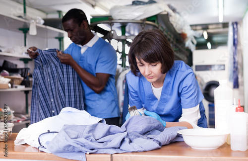 Woman working in dry cleaner