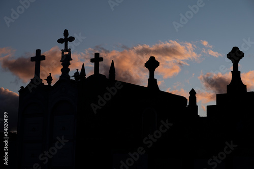 Silhouette of a cemetery at sunset