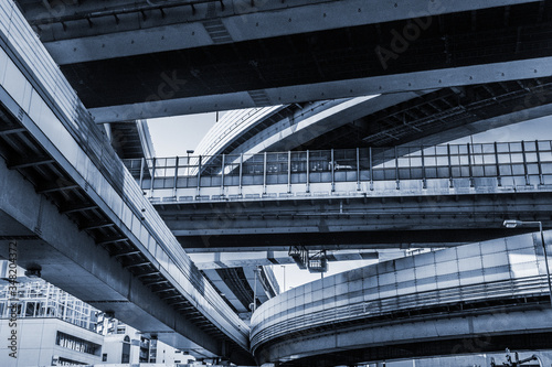 Motorways.
Blue cyanotype dystopian picture of several motorways tangled together in a futuristic megalopolis.