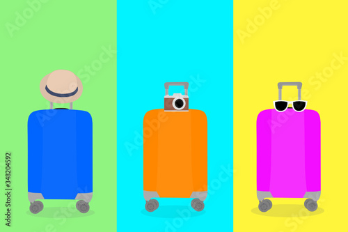 the 3 Travel bags with different color (blue, orange and pink). Suitcase with summer hat, sunglass, camera. around the World, Road trip vacation. Tourism, Journey concept. 
