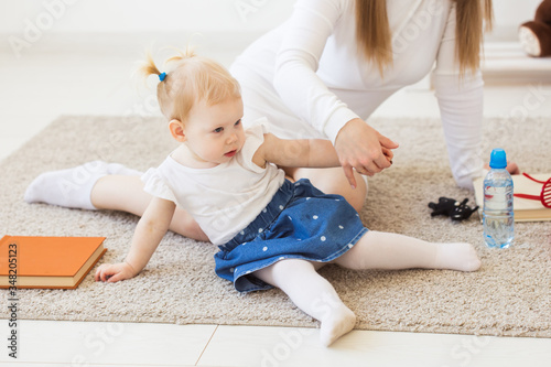 Cute baby girl playing indoors. Childhood, infant and children concept.