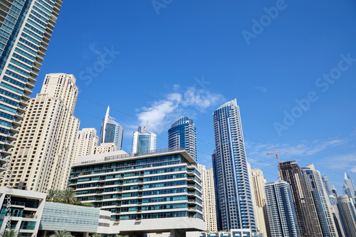 Dubai Marina skyscrapers low angle view in a sunny day, clear blue sky in Dubai