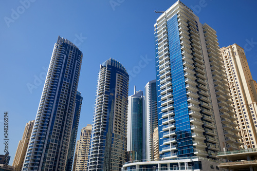 Dubai Marina skyscrapers in a sunny day, clear blue sky in Dubai