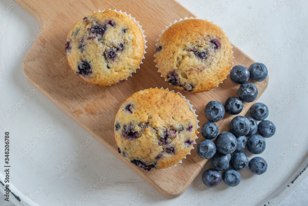 home made sweet blueberry muffin on a table home made sweet blueberry muffin on a table