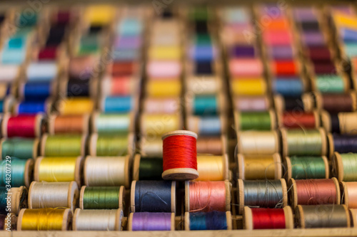 Spools of Colorful Thread. Concept of Out of Many One. E Pluribus Unum. Individuality. photo