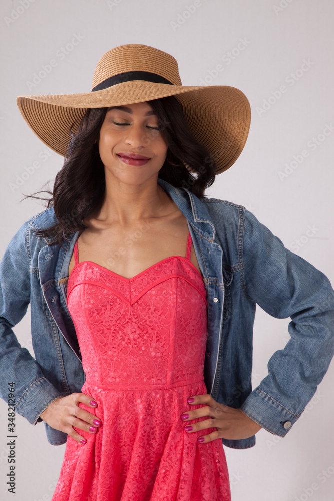Pretty woman with a straw hat and a smile