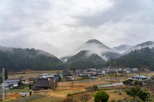 View of mountains and rural scene in foggy weather  Japanese country landscape. Oecho Naiku Town  Fukuchiyama City  Kyoto Prefecture  Japan