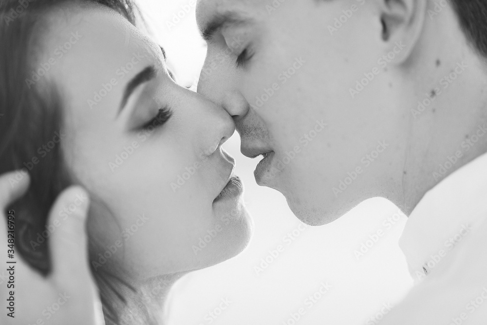 Newlyweds kisses in the desert at sunset Newlyweds kisses in the desert at sunset