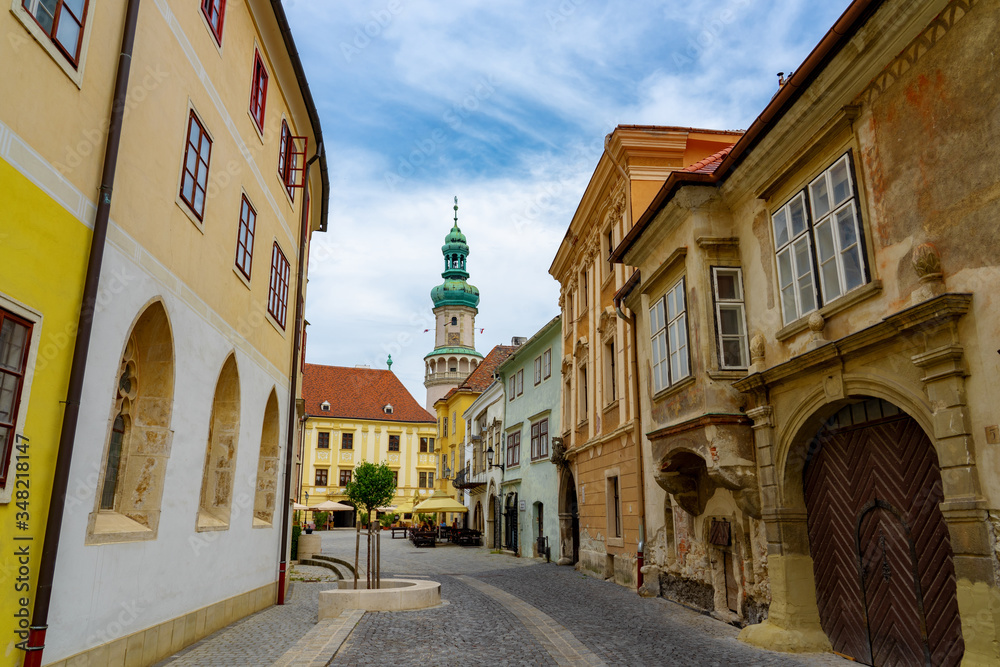 narrow medieval street of Sopron with the fire watch tower in the background