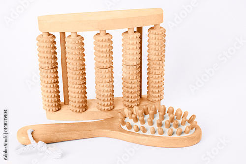 Konstfotografi Wooden massager for feet and wooden massage brush for body on a bright background