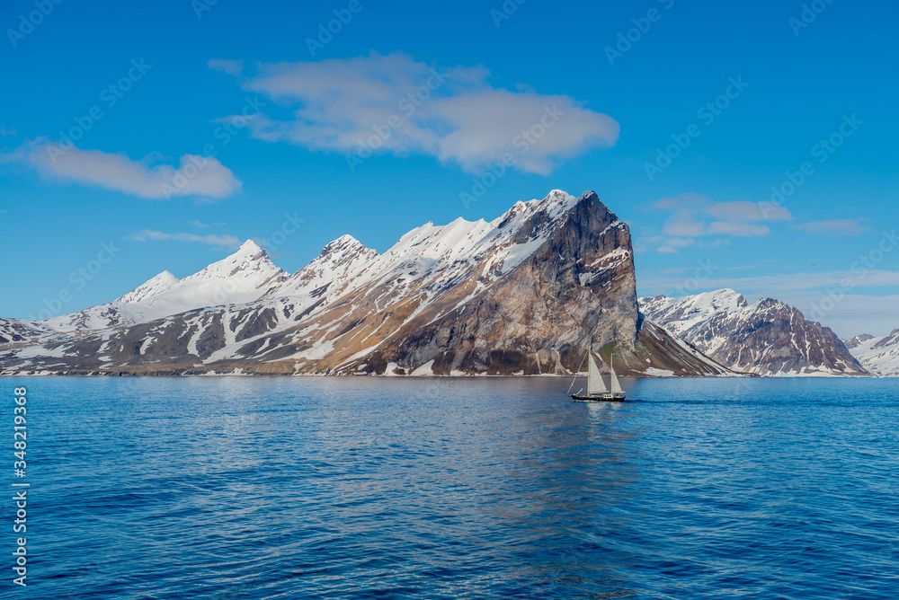 Small sailing vessel with beautiful lighting in Svalbard