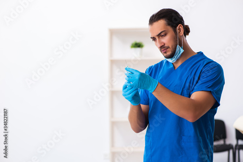Young male doctor working in the clinic