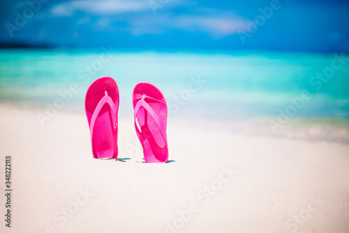 Colorful flipflop pair on the sea beach