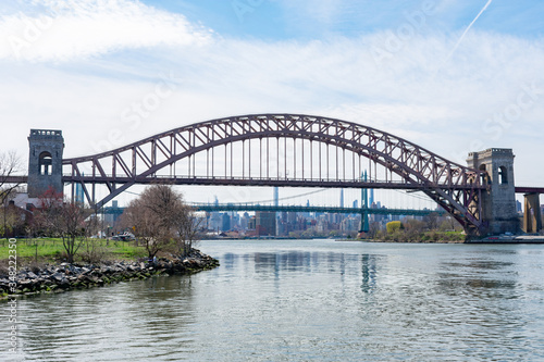 The Hell Gate Bridge over the East River during Spring in Astoria Queens New York