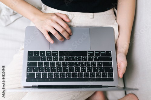 Attractive asian female working with computer laptop at home. Analyzing online data to success business