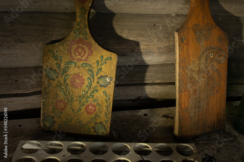 Kitchen of an old abandoned village house - kitchen utensils: cutting boards, egg cells photo