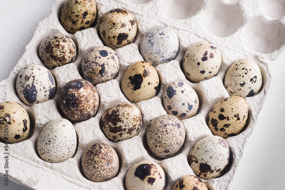 Quail eggs in cardboard packaging..Vegetarian organic eco food. Quail eggs in cardboard packaging..Vegetarian organic eco food.
