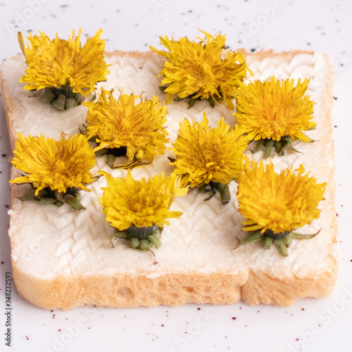 sandwich with dandelions on a plate