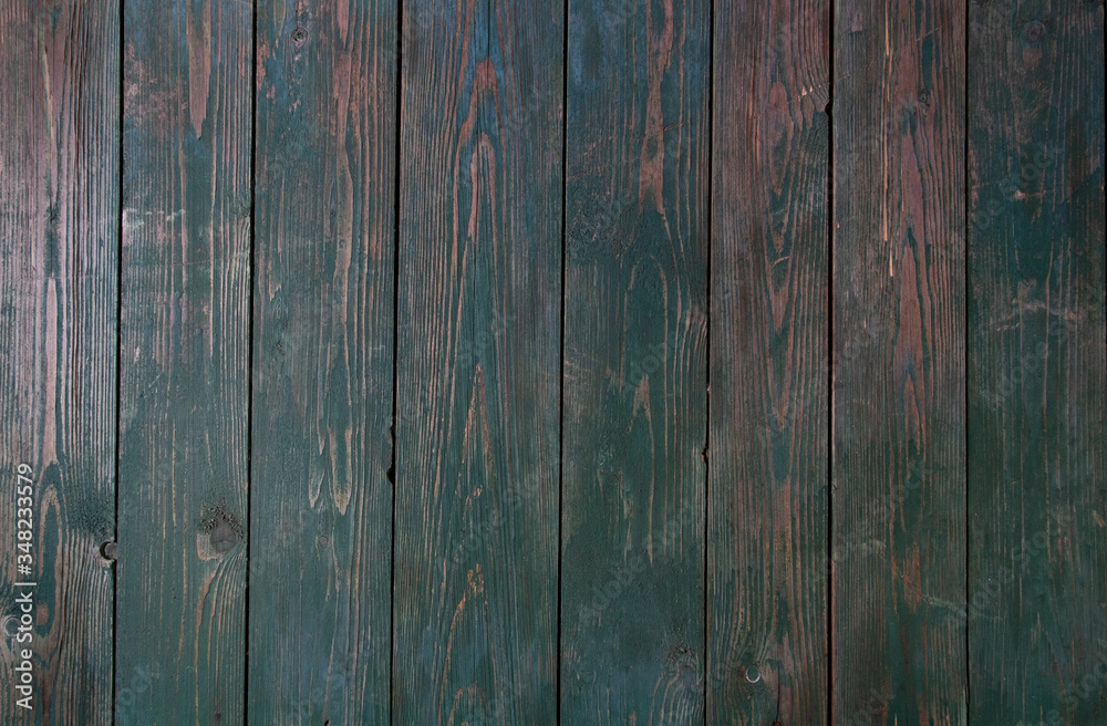 Green paint on an old wooden background. Fence. Green paint on an old wooden background. Fence.