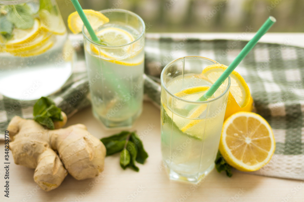 Ginger lemonade with ice and mint leaves, summer cold drink