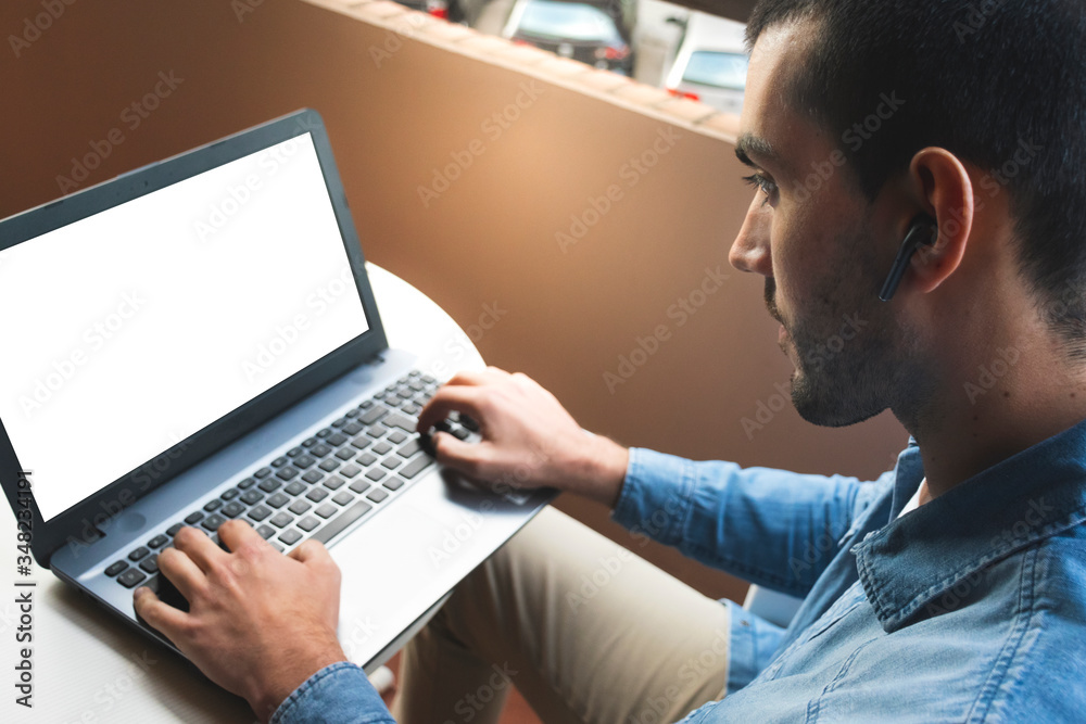 Man working with laptop at home Man working with laptop at home