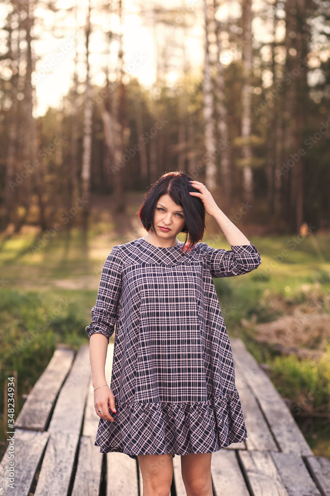 portrait of a young girl with short hair on summer nature portrait of a young girl with short hair on summer nature