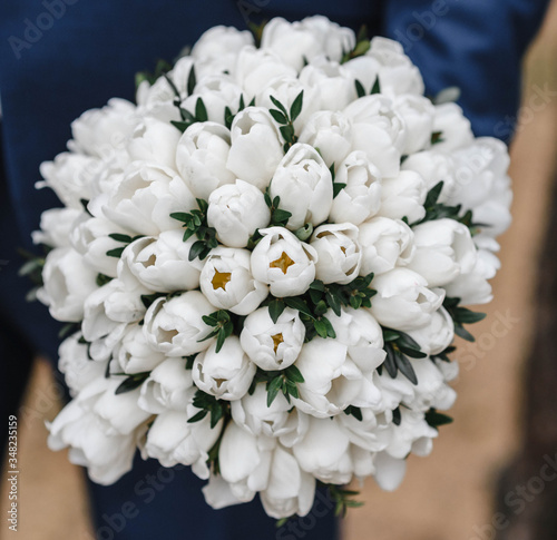 beautiful wedding bouquet in the hands of the bride. Wedding. Wedding decorations. Close-up