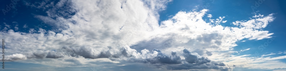 Clouds on blue sky background, ultra wide panorama