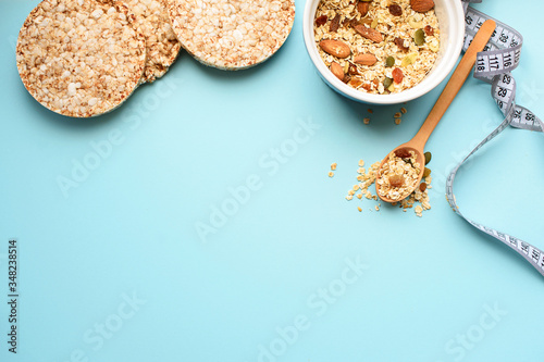 Useful breakfast, proper nutrition, oatmeal, dried fruits, breads, fruits, a centimeter on a light background. Diet. A place for text.