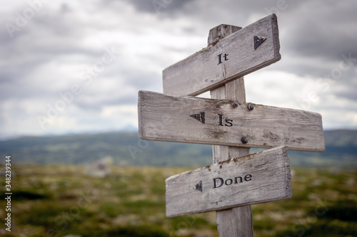 it is done text engraved on old wooden signpost outdoors in nature. Quotes, words and illustration concept.