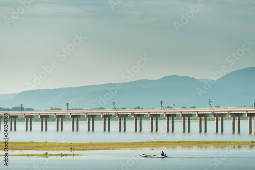 Fototapeta Naklejka Na Ścianę i Meble -  Landscape View of  Train crossing Pasak Chonlasit Dam. Reservoir for agriculture at Lopburi,Thailand