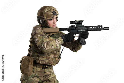 Female soldier in tactical black uniform with rifle. Shot in studio. Isolated with clipping path on white background