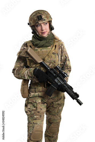Female soldier in tactical black uniform with rifle. Shot in studio. Isolated with clipping path on white background