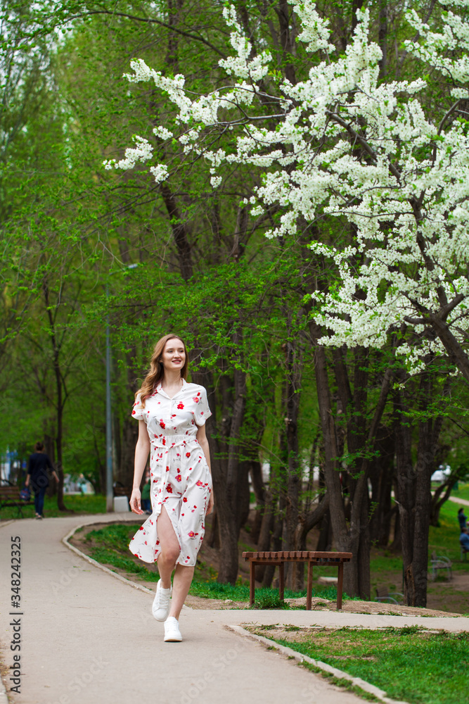 Portrait of a young beautiful blonde woman in a white dress Portrait of a young beautiful blonde woman in a white dress