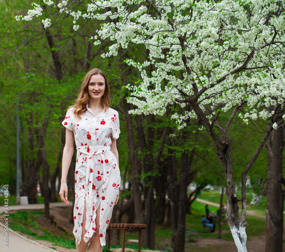 Portrait of a young beautiful blonde woman in a white dress Portrait of a young beautiful blonde woman in a white dress