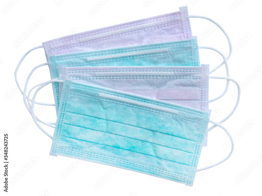 Pink and green surgical medical masks cover mouth and nose for protect allergic reaction or infectious diseases coronavirus/covid-19 isolated on white background, clipping path included Pink and green surgical medical masks cover mouth and nose for protect allergic reaction or infectious diseases coronavirus/covid-19 isolated on white background, clipping path included