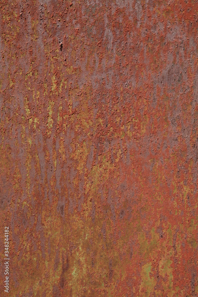 Rusted metallic wall background, texture. An old brown and rusty surface with faded uneven color. Abstract rust pattern on a fulvous (lurid) surface. The wall and fence sketches and colors Rusted metallic wall background, texture. An old brown and rusty surface with faded uneven color. Abstract rust pattern on a fulvous (lurid) surface. The wall and fence sketches and colors