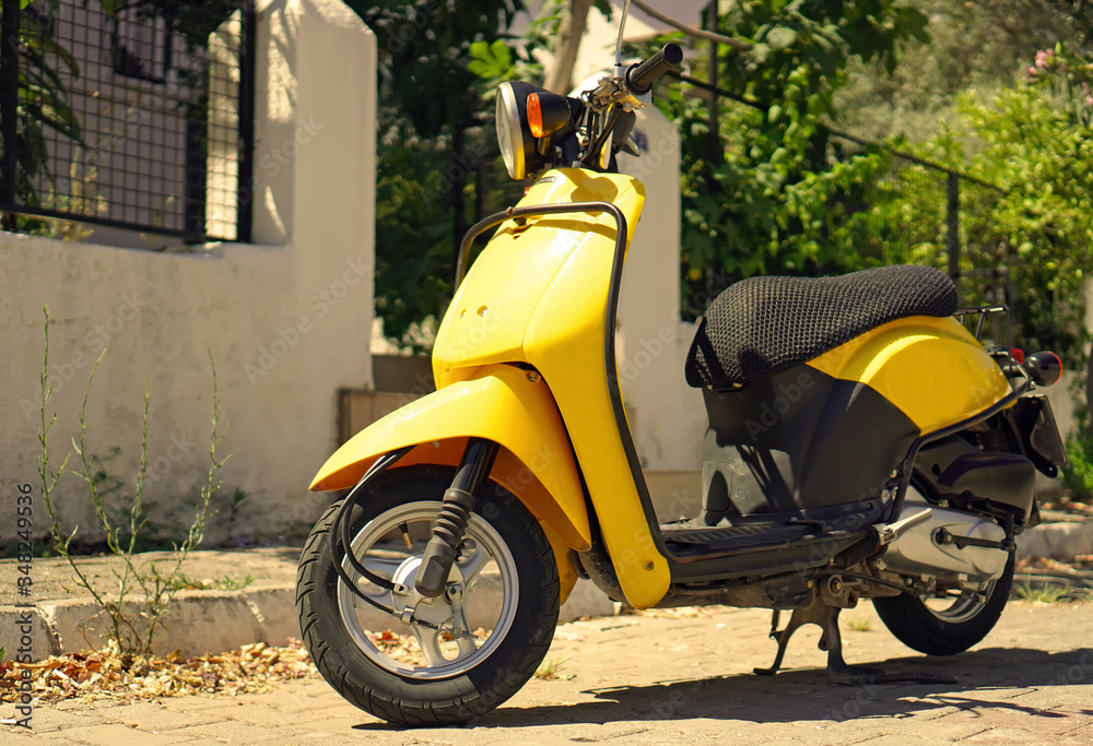 Yellow moped in the south city on the street. Yellow moped in the south city on the street. Motorcycle tourism on vacation