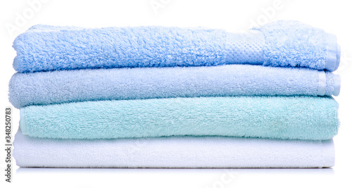 Stack of folded towels on white background isolation