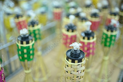 A traditional Bamboo lamp or pelita buluh over white backgrounds photo