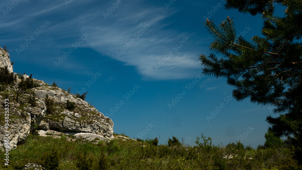 View of the Sokolich Mountains Reserve and rock stones in Olsztyn. A free space for an inscription View of the Sokolich Mountains Reserve and rock stones in Olsztyn. A free space for an inscription