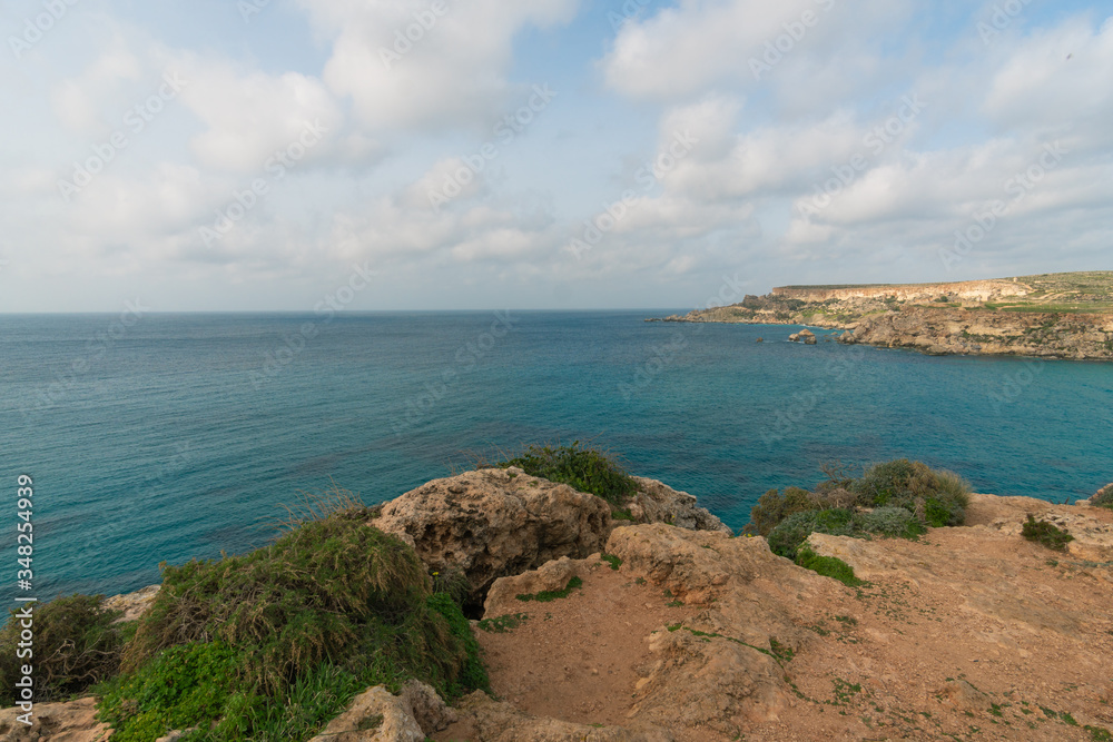 Seascape of golden bay in Malta