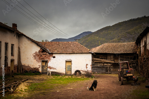 Old rustic idyllic houses in a village Topli do on Old Mountain (stara planina) in Serbia photo