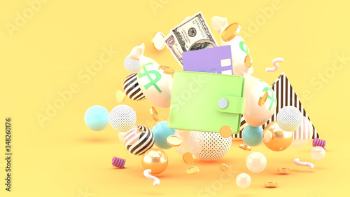 Wallet  credit card  and money amidst colorful balls on an orange background.-3d rendering.