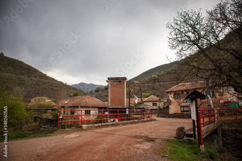 Old rustic idyllic houses in a village Topli do on Old Mountain (stara planina) in Serbia photo