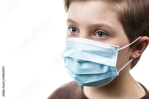 Child in medical mask on white isolated background